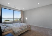5 beds 5.5 baths house on 707m² section, Panoramic Seaview, a triple garage and a private heated pool, Constructed from polished concrete blocks and aluminum, 66 Seacrest Drive, West Harbour, Auckland