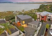 5 beds 5.5 baths house on 707m² section, Panoramic Seaview, a triple garage and a private heated pool, Constructed from polished concrete blocks and aluminum, 66 Seacrest Drive, West Harbour, Auckland