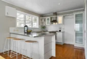 Living area polished native Rimu floors, downstairs basement area for storage, 3 beds home, minutes to Glenfield Mall, 1/18 Roberts Road, Glenfield, Auckland