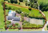 Vendor purchased elsewhere, committed selling, 436m²  Brick 5 beds + office, 4.5 bath house on 8001m² land, including 1 bed 1bath guest suite, Full-sized tennis court, pool, minutes to Albany Mall and Long Bay Village & beaches, 70 Okura River Road, Okura, Auckland