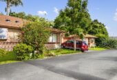 Brick and tile 2 beds 1 bath home with garage, Vacant possession available from 1 August 2027, Government-guaranteed rent of $30,680 per annum, 23/379 Swanson Road, Ranui, Auckland