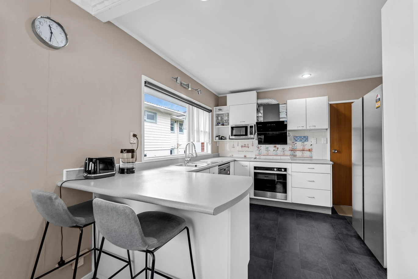 Brick and tile 3 beds 3 baths home, Plus – a self-contained area with its own entrance, featuring a sitting room, study, bathroom, Rumpus, 1/59 Glenmore Road, Sunnyhills, Auckland