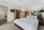 180 degrees sea views, 310m2 4 beds 3 baths house on 750m2 section, a high-stud, oversized rumpus room, a covered built-in spa, new solid weatherboard cladding, new double-glazed windows, and new CCC, 1 km to Hobsonville School, 29 Oakpark Place, West Harbour, Auckland