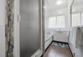 Brick and tile 3 beds 2.5 baths house on 1/2 share of 1,012m² section, A standout feature is the consented hair salon space with Certificate of Compliance, complete with its own bathroom, separate entrance and driveway access, close to schools, shops, beach, 61 Wellington Street, Howick, Auckland
