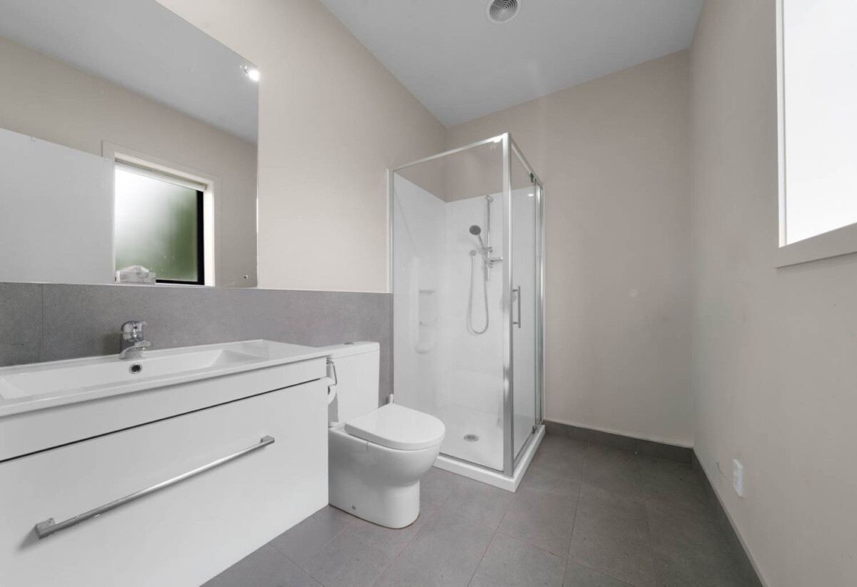 Standalone 2 beds 2 baths house on 211m2 section, Converted integrated garage – ideal third bedroom (currently used as 3rd bedroom which is carpeted & insulated) plus separate storage, close to schools, park, South Gate Shopping Centre, 17 Liberation Road, Papakura, Auckland