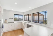 Zone for and 1.8 km to Macleans College, 4 beds 2.5 baths house with sea views on 1014m2 section, Currently operating as an Airbnb, 10 Beach Road, Mellons Bay, Auckland