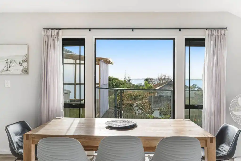 Zone for and 1.8 km to Macleans College, 4 beds 2.5 baths house with sea views on 1014m2 section, Currently operating as an Airbnb, 10 Beach Road, Mellons Bay, Auckland