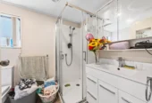 Home and income on 801m2 section, two separate three-bedroom dwellings on one title, each with its own driveway, currently rented for $1,030 per week, close to schools, golf club, shops, 18 Volante Avenue, Wattle Downs, Auckland