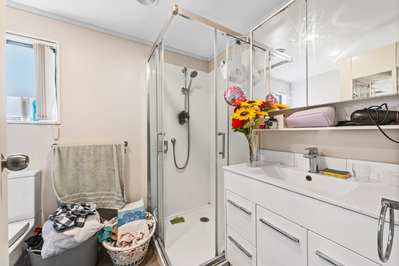 Home and income on 801m2 section, two separate three-bedroom dwellings on one title, each with its own driveway, currently rented for $1,030 per week, close to schools, golf club, shops, 18 Volante Avenue, Wattle Downs, Auckland