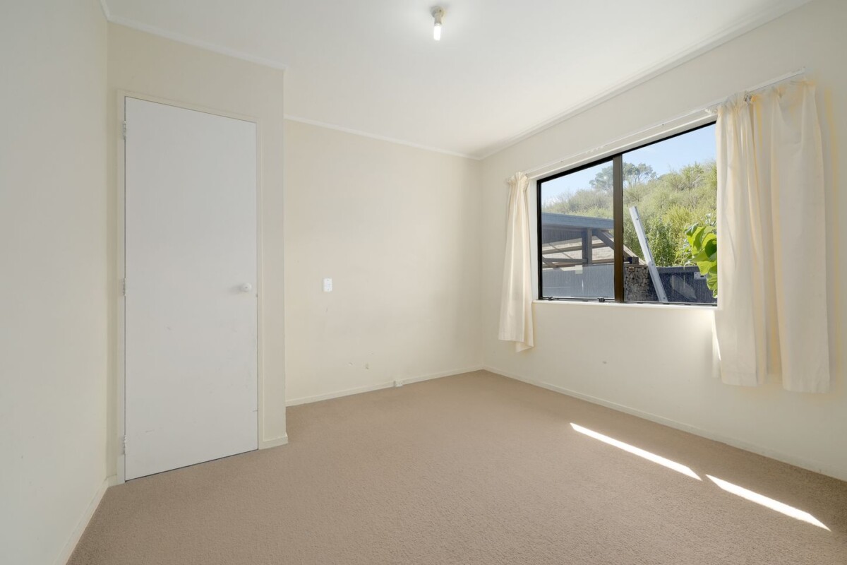 Backing directly onto Tui Glen Reserve, 3 beds 1 bath house with carport, just minutes from WestCity shopping centre, local cafes, schools, easy motorway access, 76B Chilcott Road, Henderson, Auckland