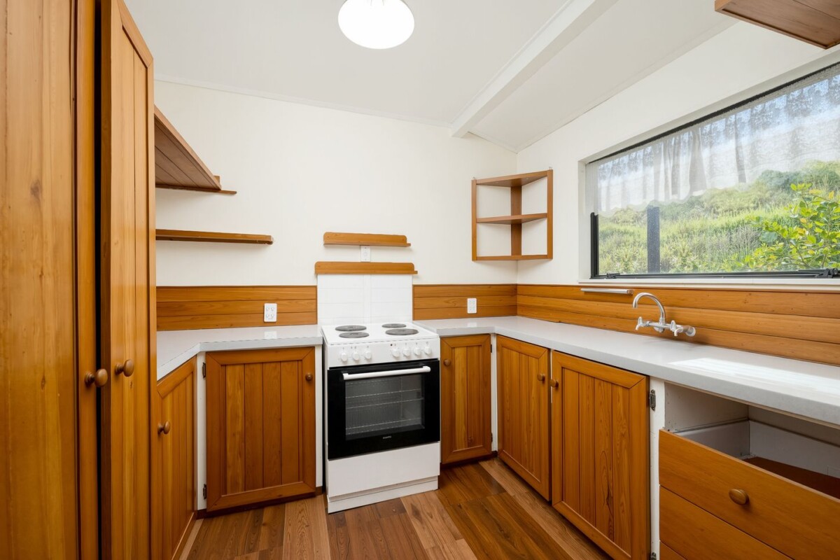 Backing directly onto Tui Glen Reserve, 3 beds 1 bath house with carport, just minutes from WestCity shopping centre, local cafes, schools, easy motorway access, 76B Chilcott Road, Henderson, Auckland