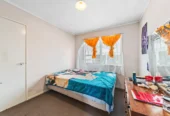 Home and income on 801m2 section, two separate three-bedroom dwellings on one title, each with its own driveway, currently rented for $1,030 per week, close to schools, golf club, shops, 18 Volante Avenue, Wattle Downs, Auckland