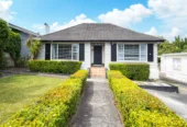 2 bed 1 bath house with garage on 809m2 section, The generous backyard provides plenty of room for kids to play, gardeners to potter, or future plans to unfold, 28 Norman Road, Titirangi, Auckland