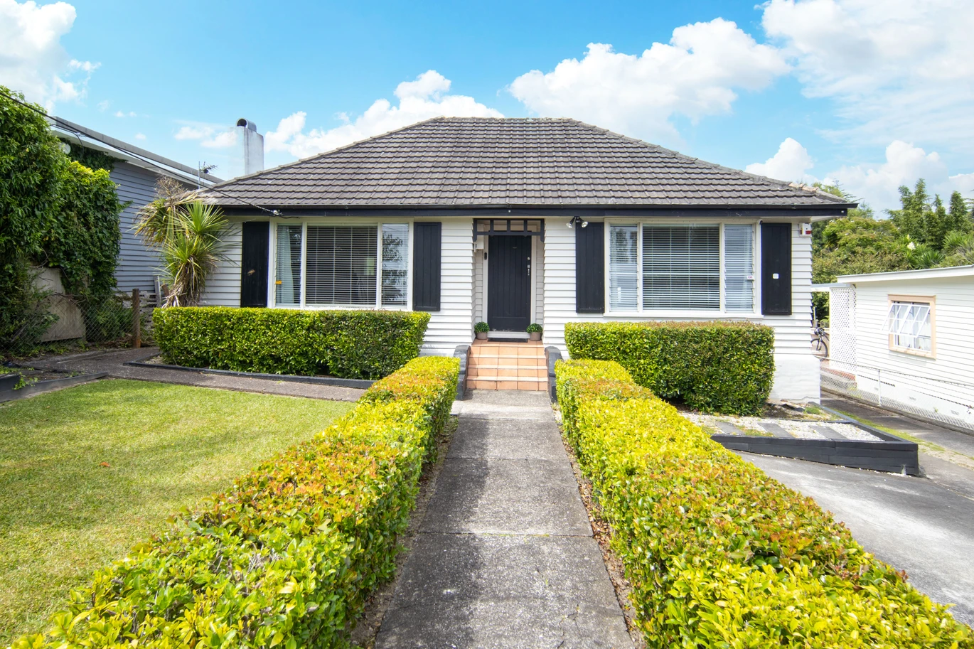2 bed 1 bath house with garage on 809m2 section, The generous backyard provides plenty of room for kids to play, gardeners to potter, or future plans to unfold, 28 Norman Road, Titirangi, Auckland
