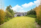 2 bed 1 bath house with garage on 809m2 section, The generous backyard provides plenty of room for kids to play, gardeners to potter, or future plans to unfold, 28 Norman Road, Titirangi, Auckland