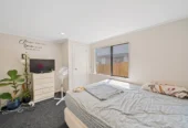 Home and income on 801m2 section, two separate three-bedroom dwellings on one title, each with its own driveway, currently rented for $1,030 per week, close to schools, golf club, shops, 18 Volante Avenue, Wattle Downs, Auckland