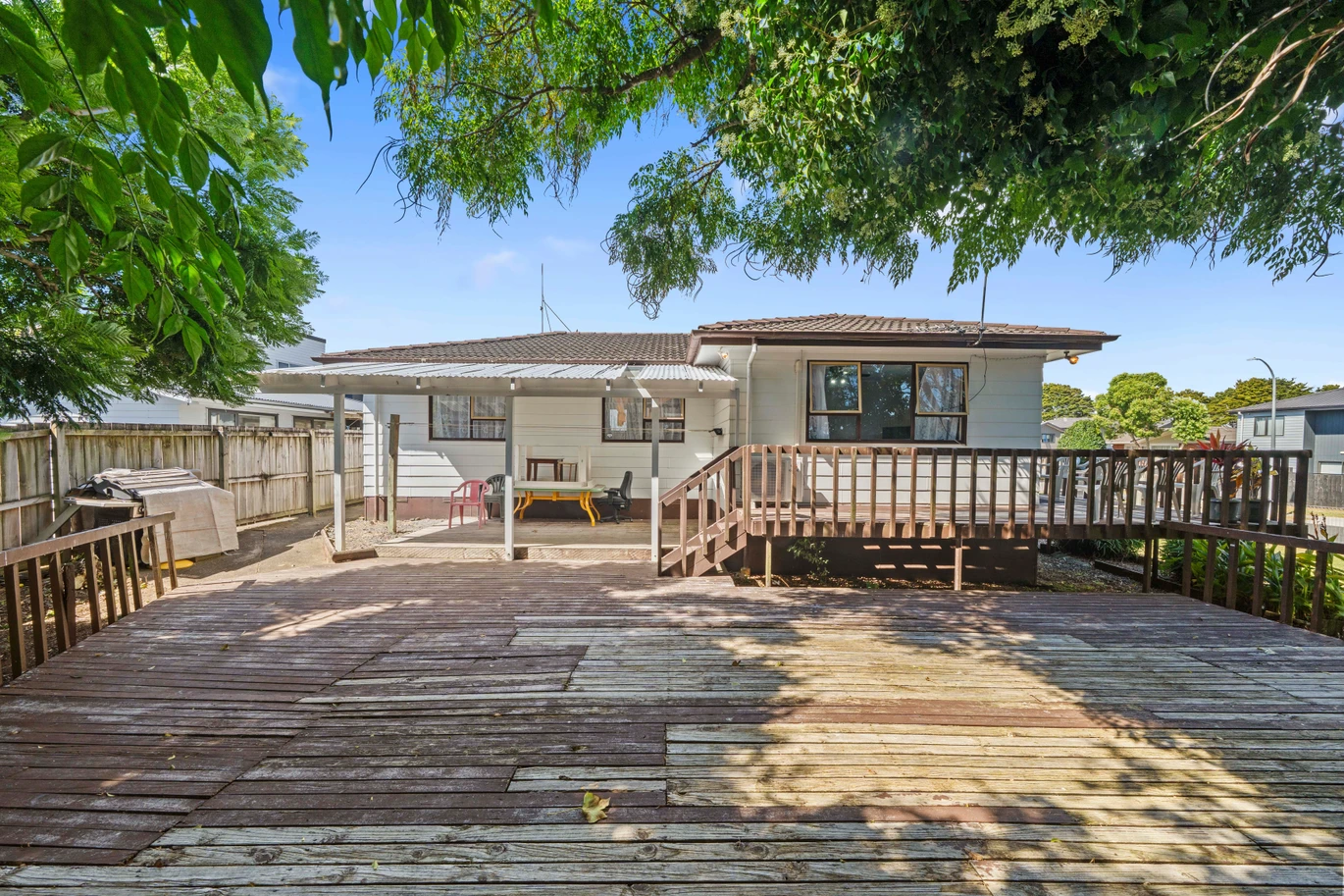 Home and income on 801m2 section, two separate three-bedroom dwellings on one title, each with its own driveway, currently rented for $1,030 per week, close to schools, golf club, shops, 18 Volante Avenue, Wattle Downs, Auckland
