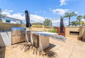 Macleans College zone, 5 beds 3 baths house with triple garage on 600m2 section, a heated pool, spa, and covered terrace with a full outdoor kitchen, close to local beaches, reserves, and Howick Village, 0.4 km to Mellons Bay School, 16 Tranquility Rise, Mellons Bay, Auckland