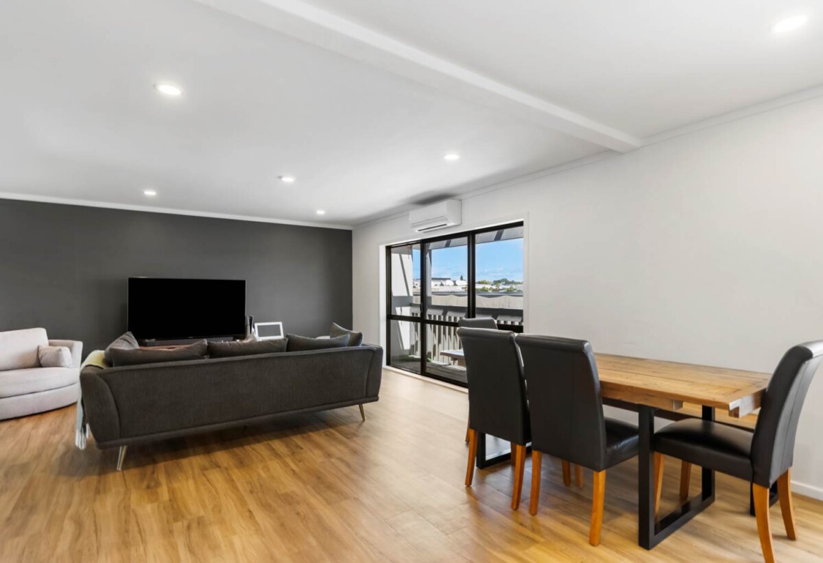 Rare Mixed-Use Opportunity, 98m2 upstairs 3 beds 1 bath apartment, 98m2 Flexible Commercial Space downstairs: 1 large office, 1 bath, Rear kitchenette area, Dedicated commercial entrance with courtyard patio, Additional large room with internal access to the double garage, Albany school zone, 15/18 Airborne Road, Rosedale, Auckland