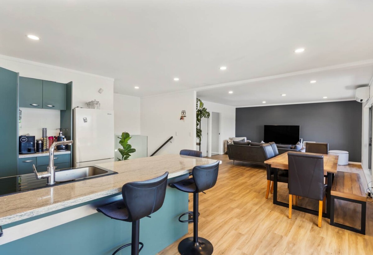 Rare Mixed-Use Opportunity, 98m2 upstairs 3 beds 1 bath apartment, 98m2 Flexible Commercial Space downstairs: 1 large office, 1 bath, Rear kitchenette area, Dedicated commercial entrance with courtyard patio, Additional large room with internal access to the double garage, Albany school zone, 15/18 Airborne Road, Rosedale, Auckland