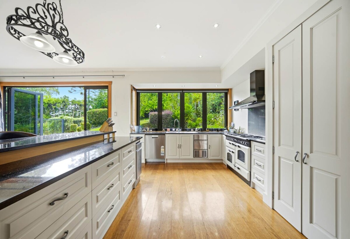 Home and income with private swimming pool on 2.5591ha waterfront land, 5 beds main home + 65sqm two-bedroom minor dwelling nestled in landscaped gardens, The Land: Five post-and-rail paddocks stand ready for horses or stock, 1.8 km to Whenuapai School, quick motorway access, a short drive to Westgate Mall, 10 Bristol Road, Whenuapai, Auckland