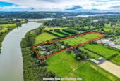 Home and income with private swimming pool on 2.5591ha waterfront land, 5 beds main home + 65sqm two-bedroom minor dwelling nestled in landscaped gardens, The Land: Five post-and-rail paddocks stand ready for horses or stock, 1.8 km to Whenuapai School, quick motorway access, a short drive to Westgate Mall, 10 Bristol Road, Whenuapai, Auckland