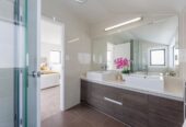 Renovated 6 beds 4 baths house with double garage on 507m2 section, zoned for top schools—including Albany Junior and Senior High—and moments from Westfield Albany, golf club, motorway access, 92 Schnapper Rock Road, Albany, Auckland