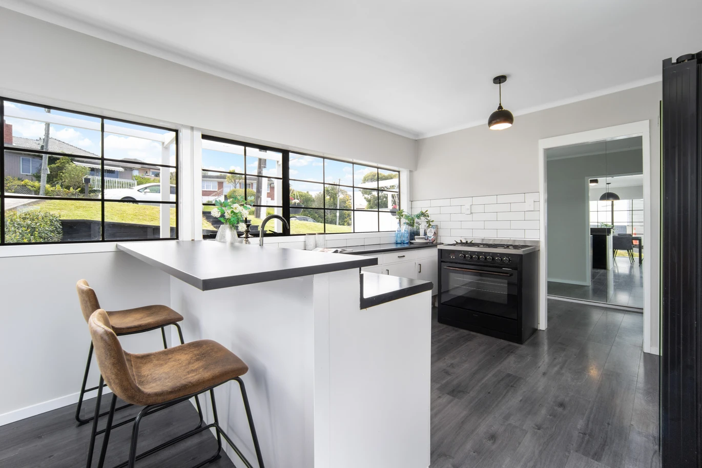 3 beds house on 766m2 section, Downstairs offers excellent additional space with a shower and two multi-purpose rooms, the Maungakiekie Golf Club is located on the same street, with shops, schools, and public transport all nearby, 13 Anita Avenue, Mount Roskill, Auckland