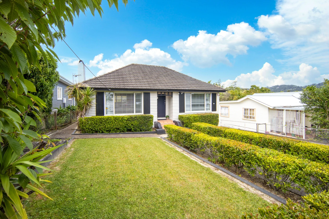 2 bed 1 bath house with garage on 809m2 section, The generous backyard provides plenty of room for kids to play, gardeners to potter, or future plans to unfold, 28 Norman Road, Titirangi, Auckland