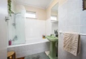 2 bed 1 bath house with garage on 809m2 section, The generous backyard provides plenty of room for kids to play, gardeners to potter, or future plans to unfold, 28 Norman Road, Titirangi, Auckland