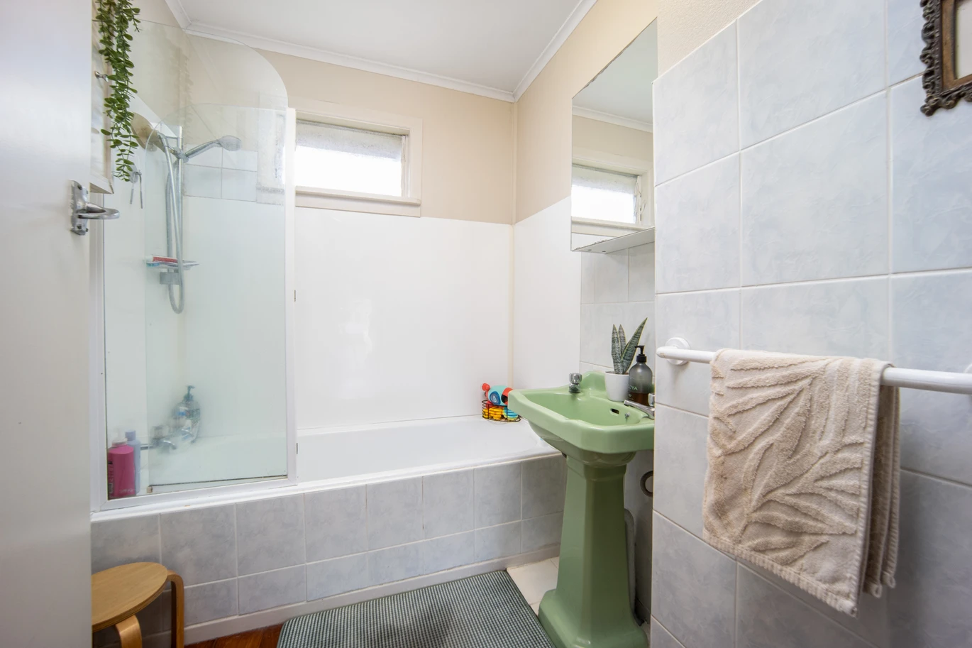 2 bed 1 bath house with garage on 809m2 section, The generous backyard provides plenty of room for kids to play, gardeners to potter, or future plans to unfold, 28 Norman Road, Titirangi, Auckland