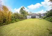 2 bed 1 bath house with garage on 809m2 section, The generous backyard provides plenty of room for kids to play, gardeners to potter, or future plans to unfold, 28 Norman Road, Titirangi, Auckland