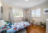2 bed 1 bath house with garage on 809m2 section, The generous backyard provides plenty of room for kids to play, gardeners to potter, or future plans to unfold, 28 Norman Road, Titirangi, Auckland