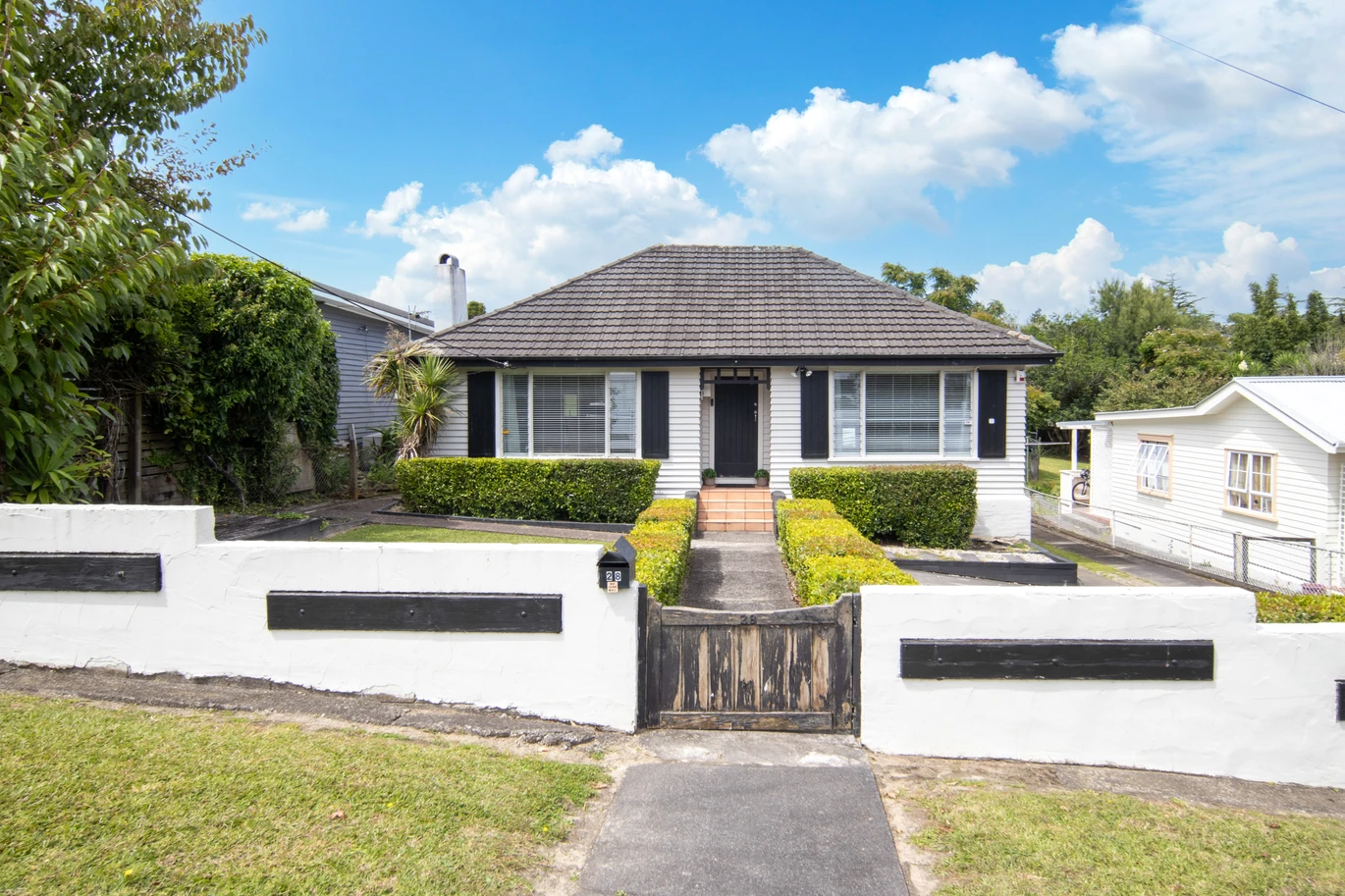 2 bed 1 bath house with garage on 809m2 section, The generous backyard provides plenty of room for kids to play, gardeners to potter, or future plans to unfold, 28 Norman Road, Titirangi, Auckland