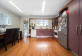 2 bed 1 bath house with garage on 809m2 section, The generous backyard provides plenty of room for kids to play, gardeners to potter, or future plans to unfold, 28 Norman Road, Titirangi, Auckland