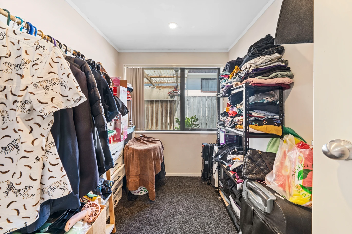Home and income on 801m2 section, two separate three-bedroom dwellings on one title, each with its own driveway, currently rented for $1,030 per week, close to schools, golf club, shops, 18 Volante Avenue, Wattle Downs, Auckland