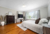 2 bed 1 bath house with garage on 809m2 section, The generous backyard provides plenty of room for kids to play, gardeners to potter, or future plans to unfold, 28 Norman Road, Titirangi, Auckland