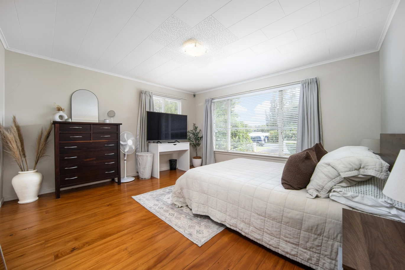 2 bed 1 bath house with garage on 809m2 section, The generous backyard provides plenty of room for kids to play, gardeners to potter, or future plans to unfold, 28 Norman Road, Titirangi, Auckland