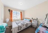 Home and income on 801m2 section, two separate three-bedroom dwellings on one title, each with its own driveway, currently rented for $1,030 per week, close to schools, golf club, shops, 18 Volante Avenue, Wattle Downs, Auckland