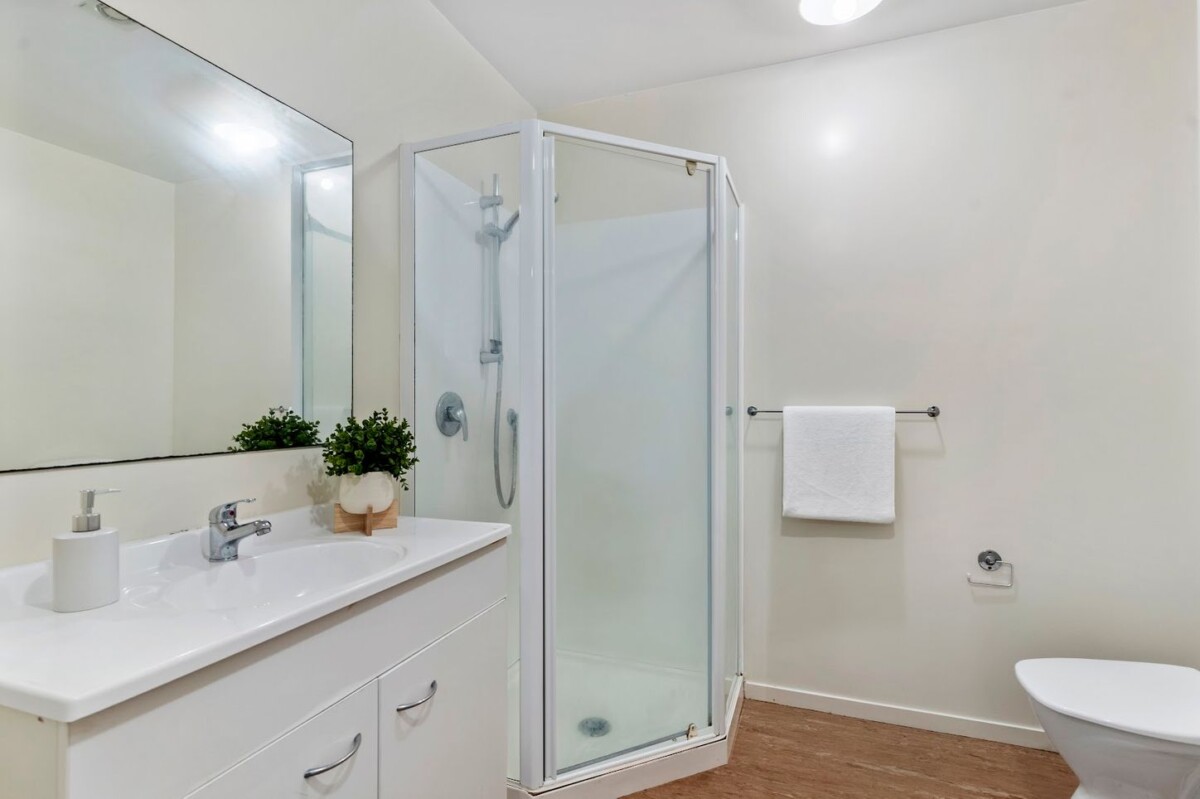 Vendors determined to sell, 67m2 2 beds 1 bath home with car park and a private backyard,, close to shops, schools, easy motorway access, 1/242 Great North Road, Henderson, Auckland