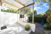 Once in 26 years, Constructed in block, 2 beds 1 bath home with garage, close to Green Bay Village, quality schooling, and public transport, With a park and playground just a short stroll away, 1/39 Cliff View Drive, Green Bay, Auckland