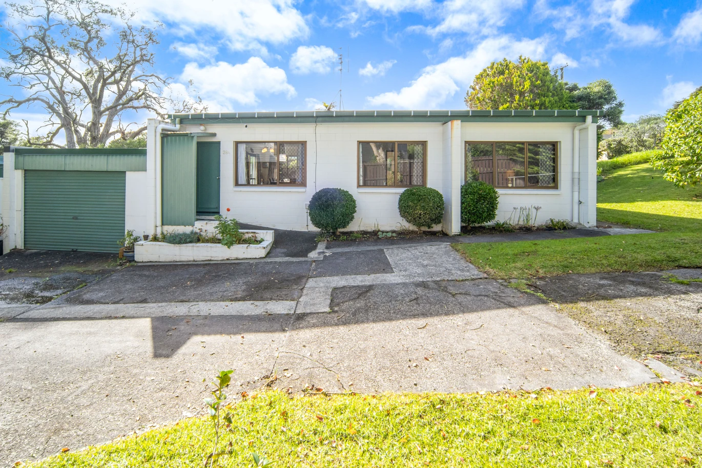 Once in 26 years, Constructed in block, 2 beds 1 bath home with garage, close to Green Bay Village, quality schooling, and public transport, With a park and playground just a short stroll away, 1/39 Cliff View Drive, Green Bay, Auckland