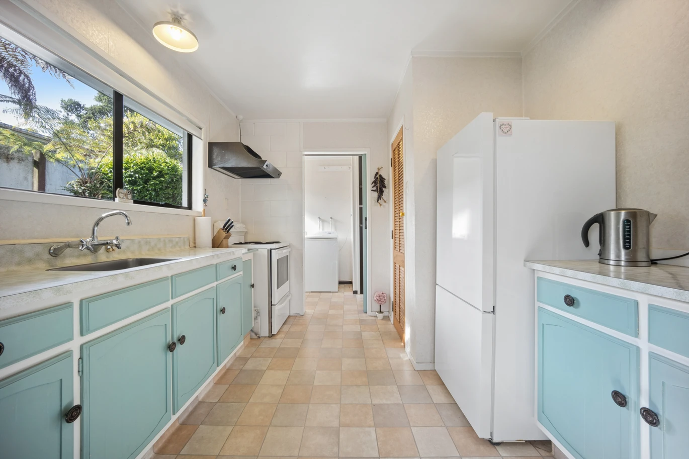 Once in 26 years, Constructed in block, 2 beds 1 bath home with garage, close to Green Bay Village, quality schooling, and public transport, With a park and playground just a short stroll away, 1/39 Cliff View Drive, Green Bay, Auckland