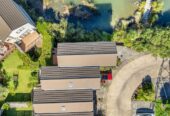 Owners have bought – Must sell, 132m2 2 beds 1 bath home with garage for 2 cars, Enjoy peaceful outlooks with lovely views across the pond, close to local amenities, schools, and transport links, 80/172 McLeod Road, Te Atatu South, Auckland