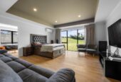 Urgent Sale, Vendor is selling below CV., make an offer, 5 beds + 2 flexi rooms 3 baths house with tripple garage on 3926m2 section, Designed and built by GJ Gardner in 2023, 10-Year Master Build Warranty, Central heating and surround sound system, 2 x 30,000L (more or less) water tanks, Fully fenced backyard, Opposite a reserve , close to schools, amenities, and with easy motorway access, 1.3 km to Pokeno School, 21 Te Ara Aukati Terrace, Pokeno, Auckland