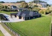 Urgent Sale, Vendor is selling below CV., make an offer, 5 beds + 2 flexi rooms 3 baths house with tripple garage on 3926m2 section, Designed and built by GJ Gardner in 2023, 10-Year Master Build Warranty, Central heating and surround sound system, 2 x 30,000L (more or less) water tanks, Fully fenced backyard, Opposite a reserve , close to schools, amenities, and with easy motorway access, 1.3 km to Pokeno School, 21 Te Ara Aukati Terrace, Pokeno, Auckland