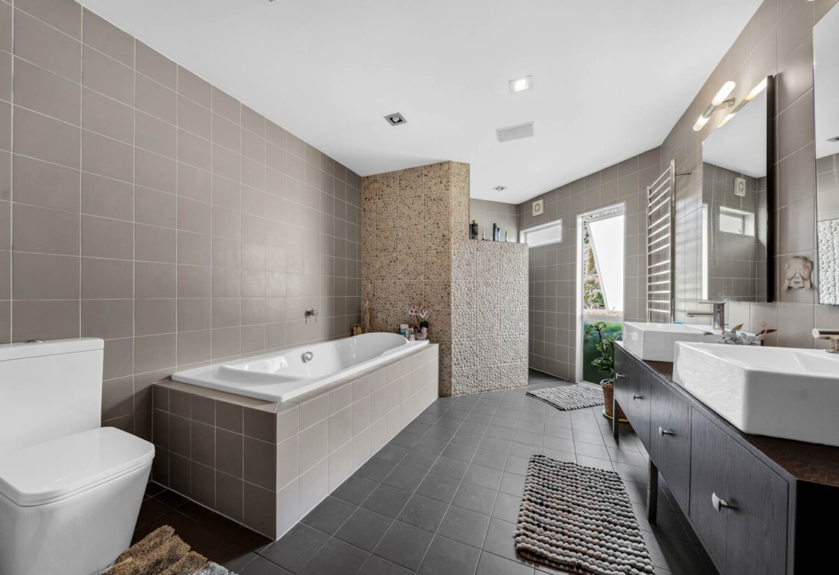 5052m2 section, 6 beds 4 baths ( 5 beds 3 baths triple garage main house + standalone 1 bed 1 bath kitchen, living and garage sleepout) house, with a heated swimming pool, Surrounded by established greenery, close to local amenities, schools, and motorway connections, 1.2 km to Alfriston College and Alfriston School, 21 Everlea Place, Alfriston, Auckland