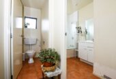 142m2 Brick and tile 4 beds 2.5 baths house with double garage on 475m2 section, Currently leased to Housing New Zealand until 30 November 2028, with annual gross rental income of $38,480, close to shops, schools, motorway access, 0.5 km to Jean Batten School, 1 Orrell Place, Mangere, Auckland
