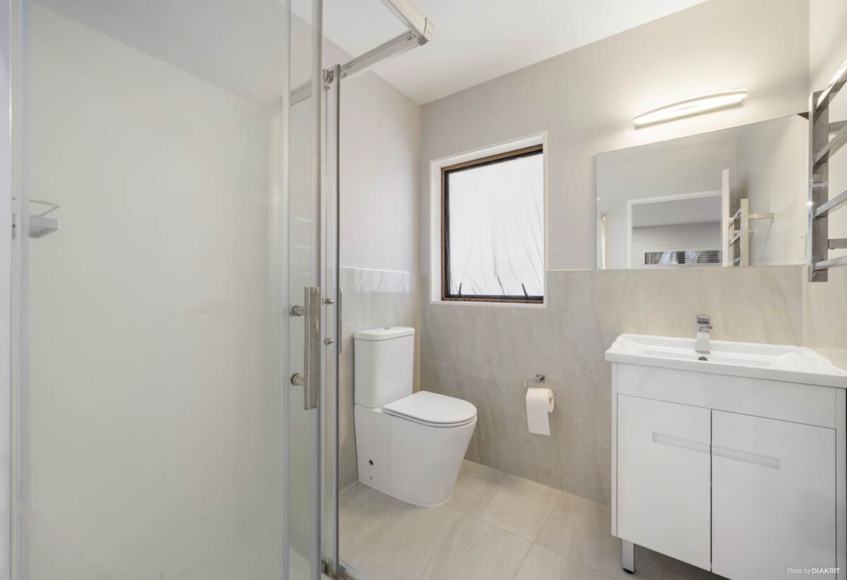 Modern Split-Level Living with Income Potential, 4 beds 3 baths house with garage on 574m2 section, close to schools, shops, motorway access, 0.7 km to Royal Road School, 5A Benchmark Drive, Massey, Auckland
