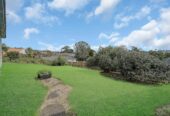 Mt Roskill Grammar zone, 3 beds 1 bath house with standalone garage on 895m2 section, Ground-floor rumpus with exterior access – home office or studio ready, close to schools, shops, motorway access, 0.6 km to Hay Park School, 9 Morrie Laing Avenue, Mt Roskill, Auckland